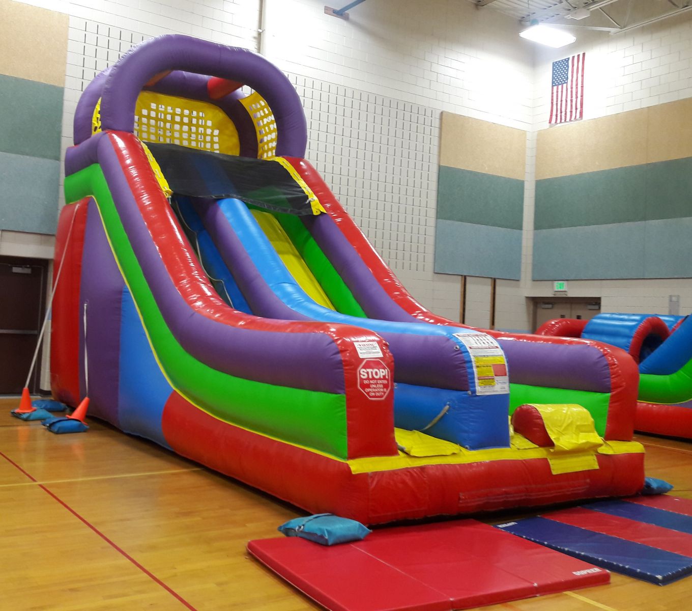 Inflatable dry slide inside school gym